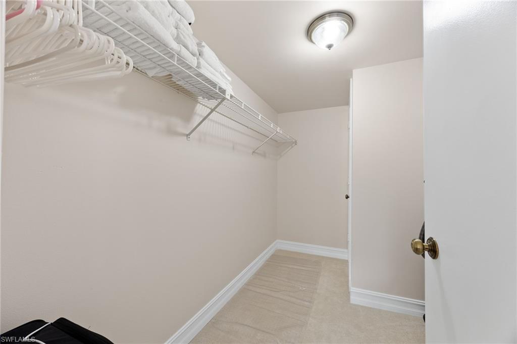 5683 Rattlesnake Hammock Road, Unit A202 Naples, FL 34113 - Photo 17 of 27 Primary large walk in closet