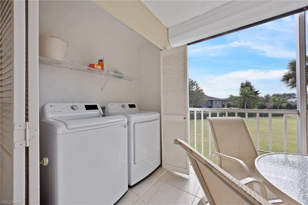 5683 Rattlesnake Hammock Road, Unit A202 Naples, FL 34113 - Photo 21 of 27 Laundry area located just off the covered enclosed lanai