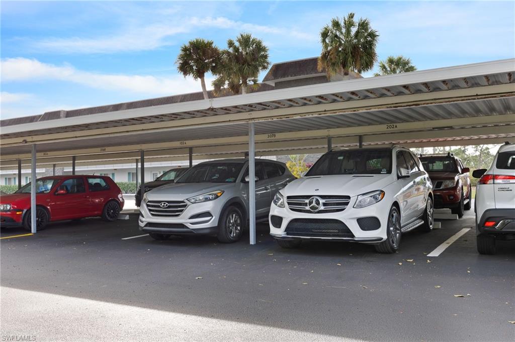 5683 Rattlesnake Hammock Road, Unit A202 Naples, FL 34113 - Photo 26 of 27 Assigned carport