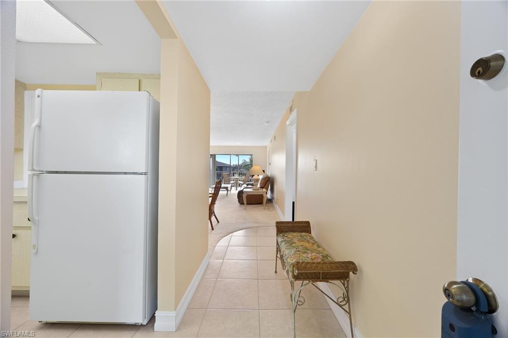5683 Rattlesnake Hammock Road, Unit A202 Naples, FL 34113 - Photo 3 of 27 Tiled entry way