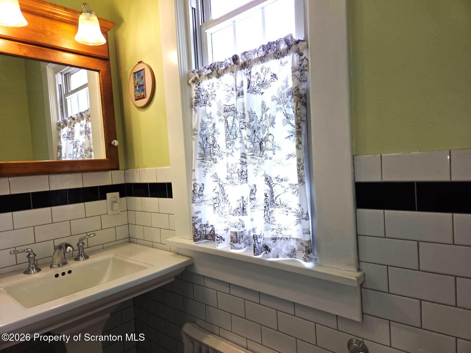 229 East Mountain Road Scranton, PA 18505 - Photo 32 of 47 a bathroom with a sink and a mirror