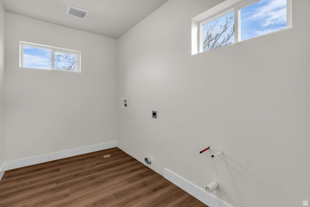 576 7th Avenue Midvale, UT 84047 - Photo 10 of 32 Laundry room featuring hookup for a washing machine, dark wood-style flooring, and hookup for an electric dryer