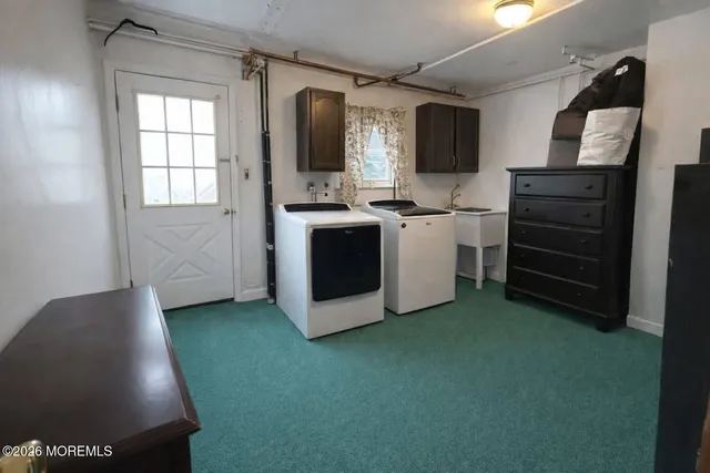 a kitchen with a refrigerator and a stove