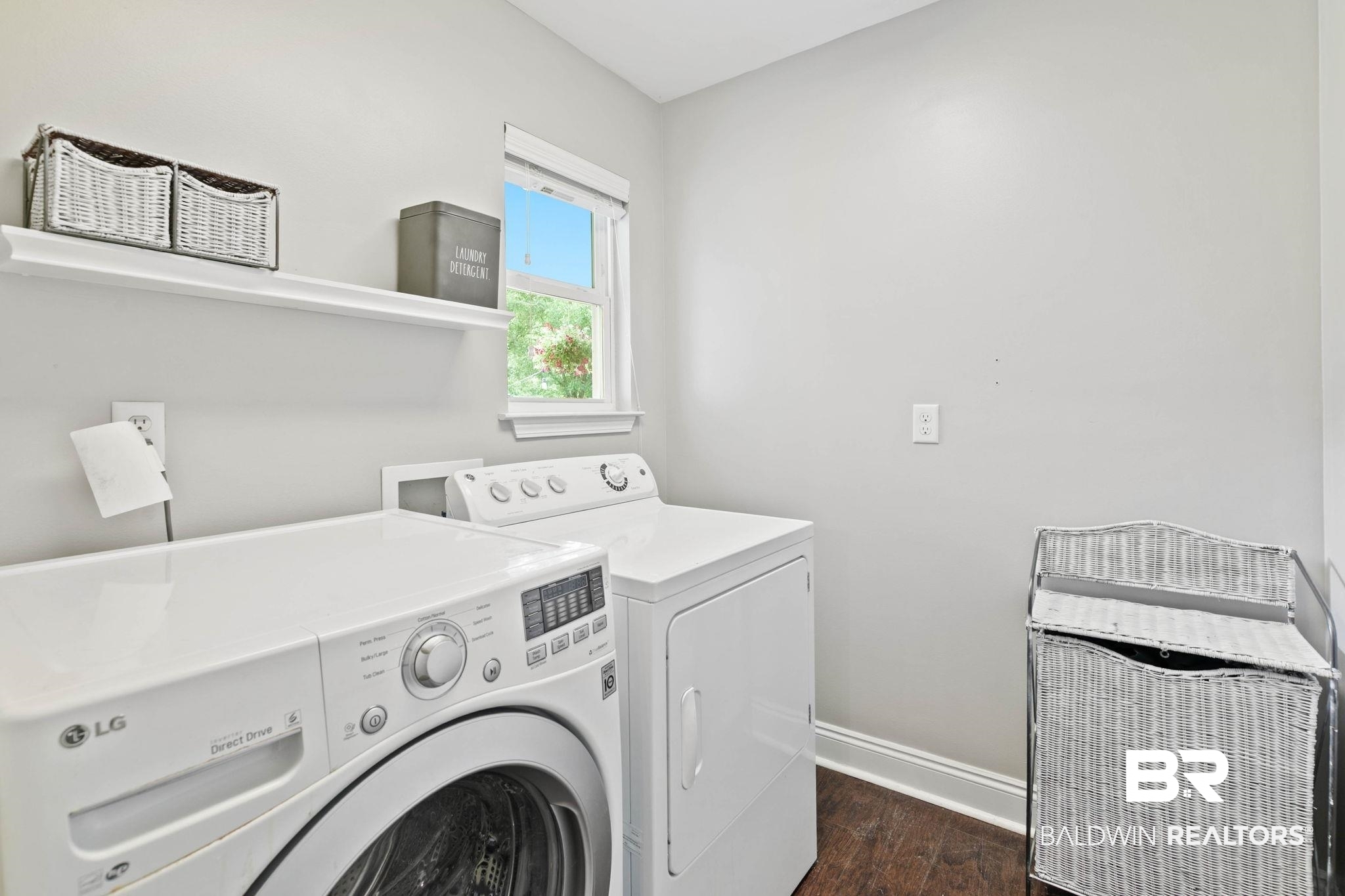 22810 High Ridge Road Fairhope, AL 36532 - Photo 40 of 78 Dedicated laundry space featuring a window, built-in shelving, and wood-finish flooring