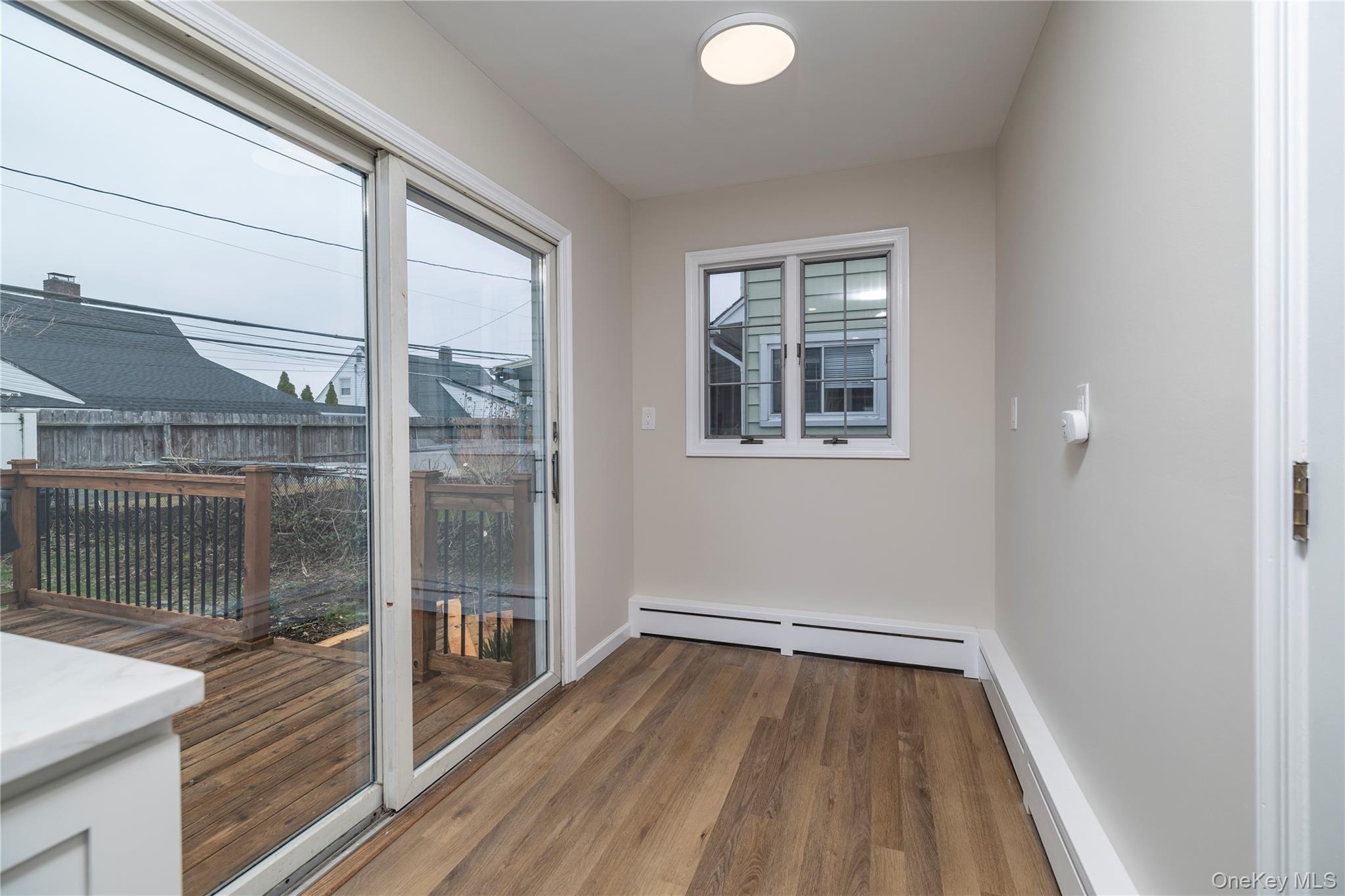 485 Farm Ranch Road West Bethpage, NY 11714 - Photo 13 of 26 Eat in Kitchen with Sliding Glass Doors to Backyard