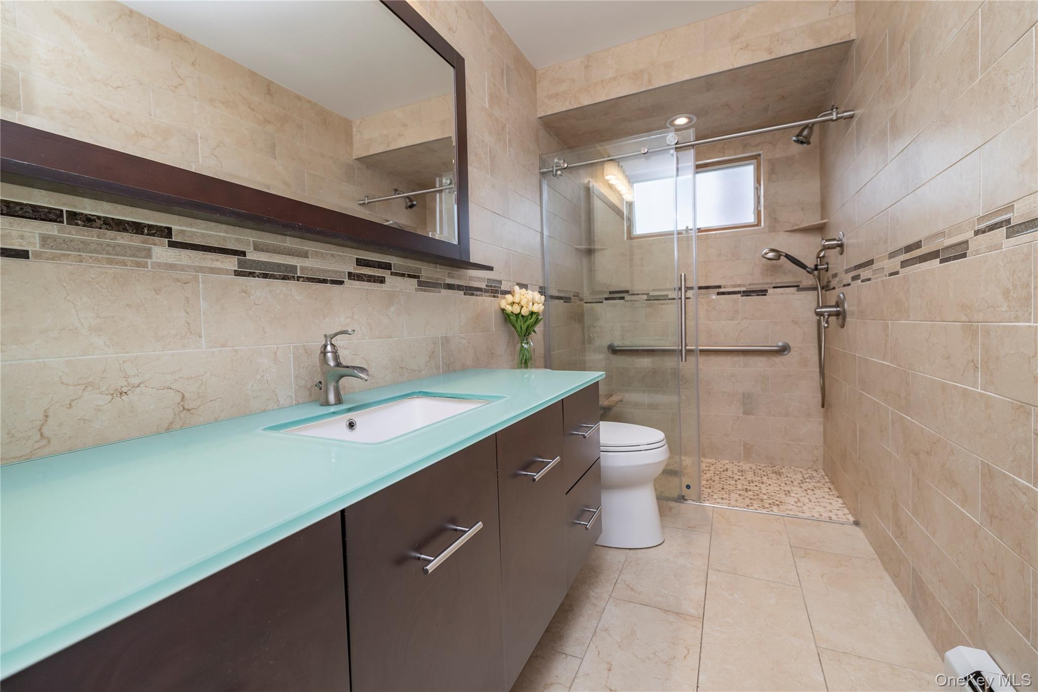 485 Farm Ranch Road West Bethpage, NY 11714 - Photo 23 of 26 Full Tile Surround Bathroom with Large Vanity with Glass Top