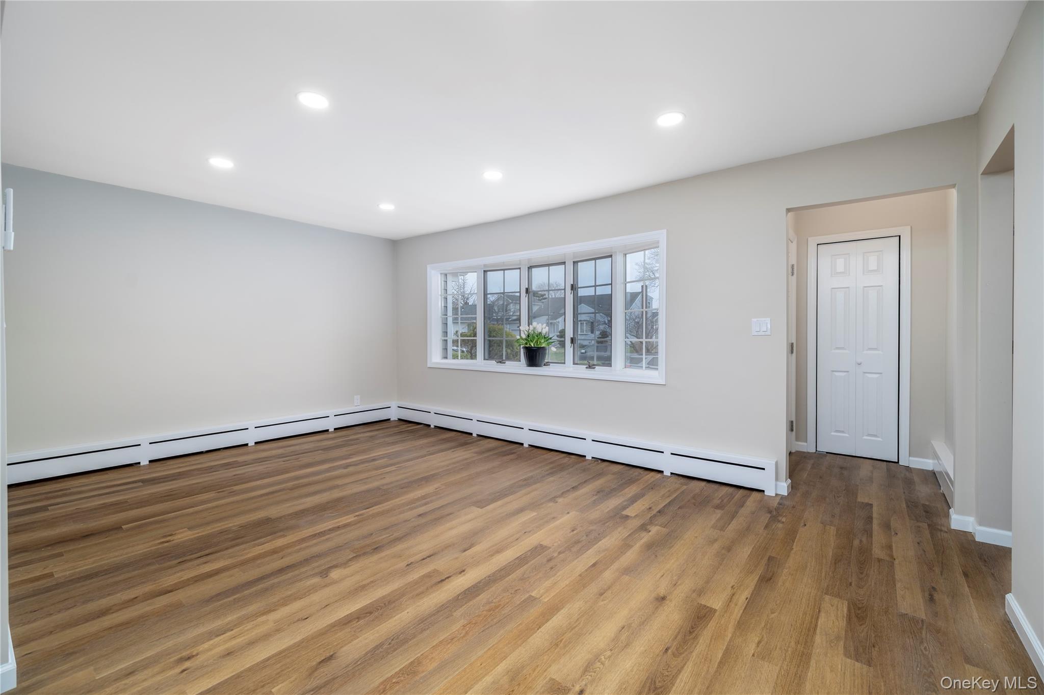 485 Farm Ranch Road West Bethpage, NY 11714 - Photo 5 of 26 Bright and Sunny New High Hat Lights, New Vinyl Flooring and Freshly Painted