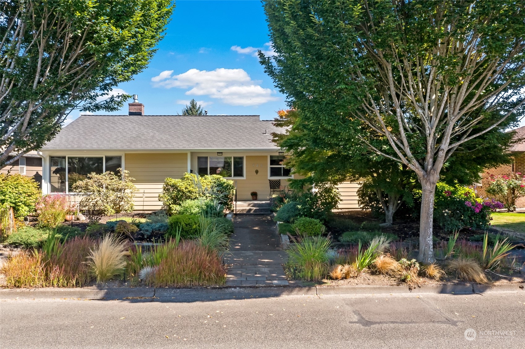 a front view of house with garden