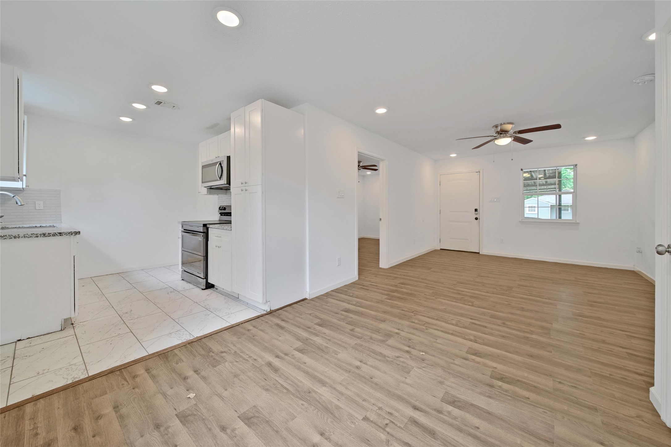 7346 Calais Road Houston, TX 77033 - Photo 3 of 9 a view of an empty room with a window