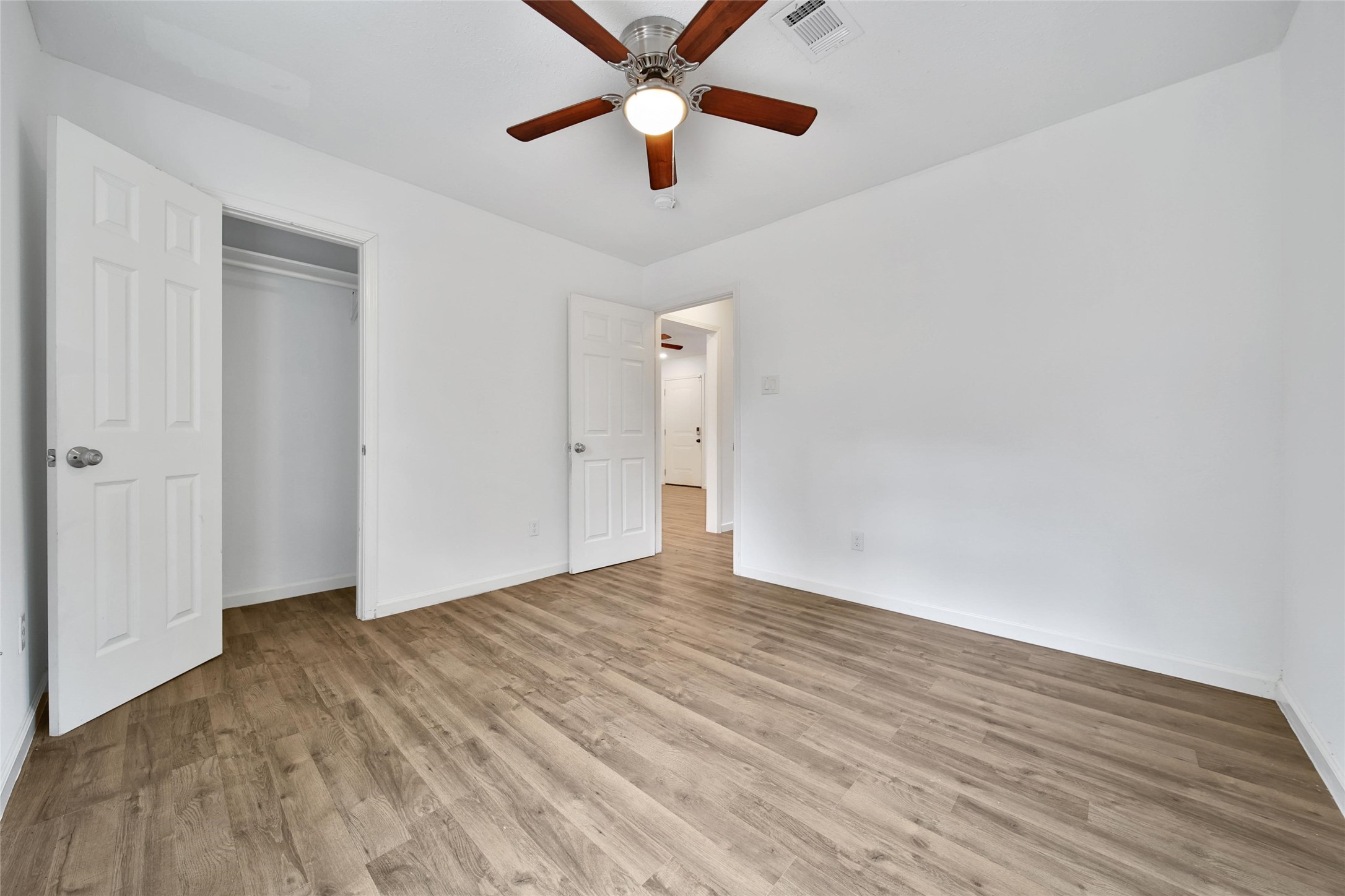 7346 Calais Road Houston, TX 77033 - Photo 6 of 9 wooden floor in an empty room