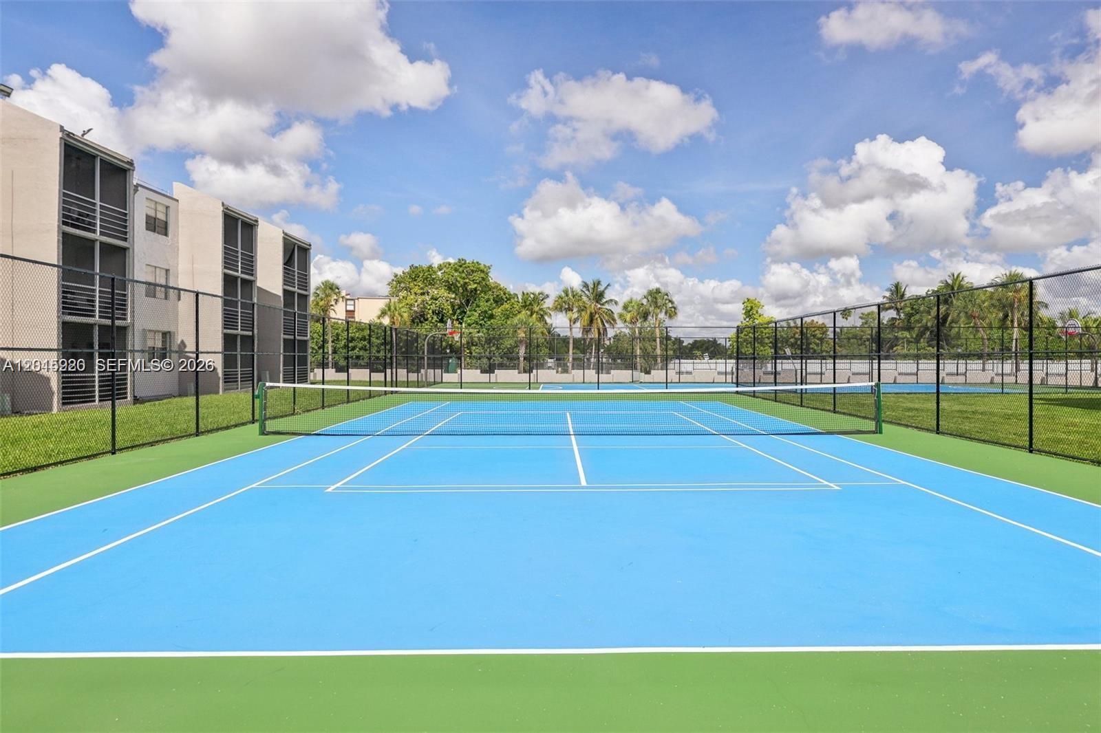 14170 Southwest 84th Street, Unit 404F Miami, FL 33183 - Photo 14 of 18 a view of a volley ball court
