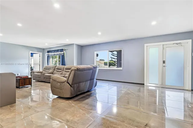 a living room with furniture and a window