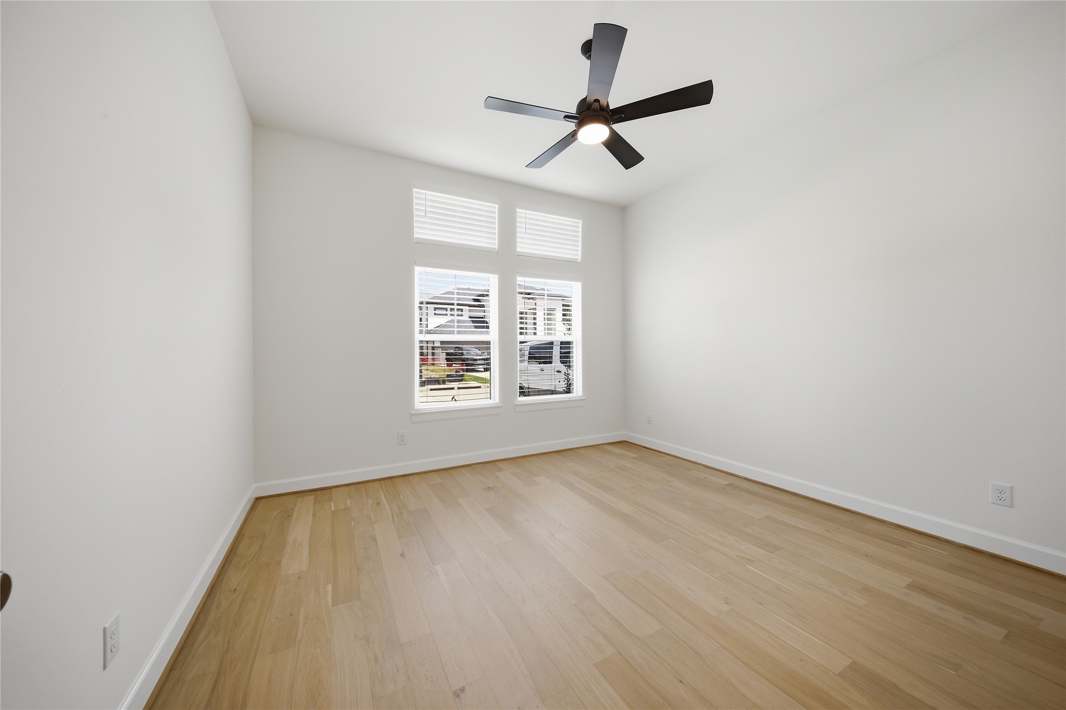 416 Venado View Court Conroe, TX 77304 - Photo 21 of 34 Secondary bedroom with large windows and abundant natural light