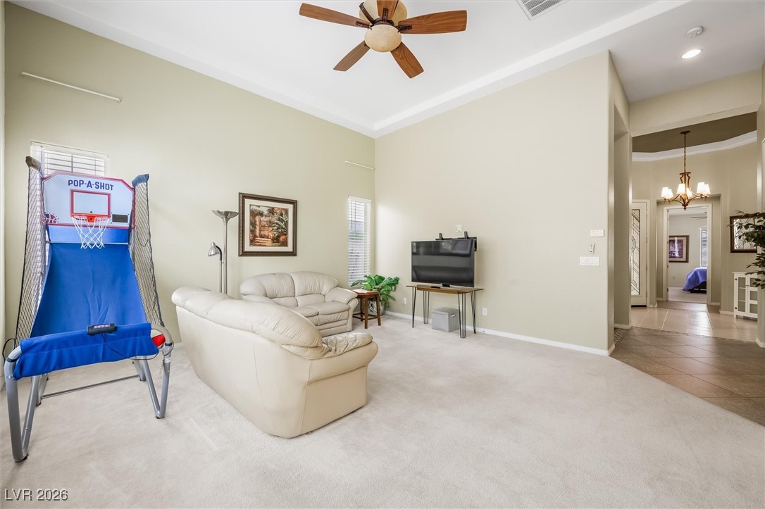 7517 Midnight Rambler Street Las Vegas, NV 89149 - Photo 17 of 68 Another view of the living room looking down the hall to foyer-entry way and the first level bedroom ensuite
