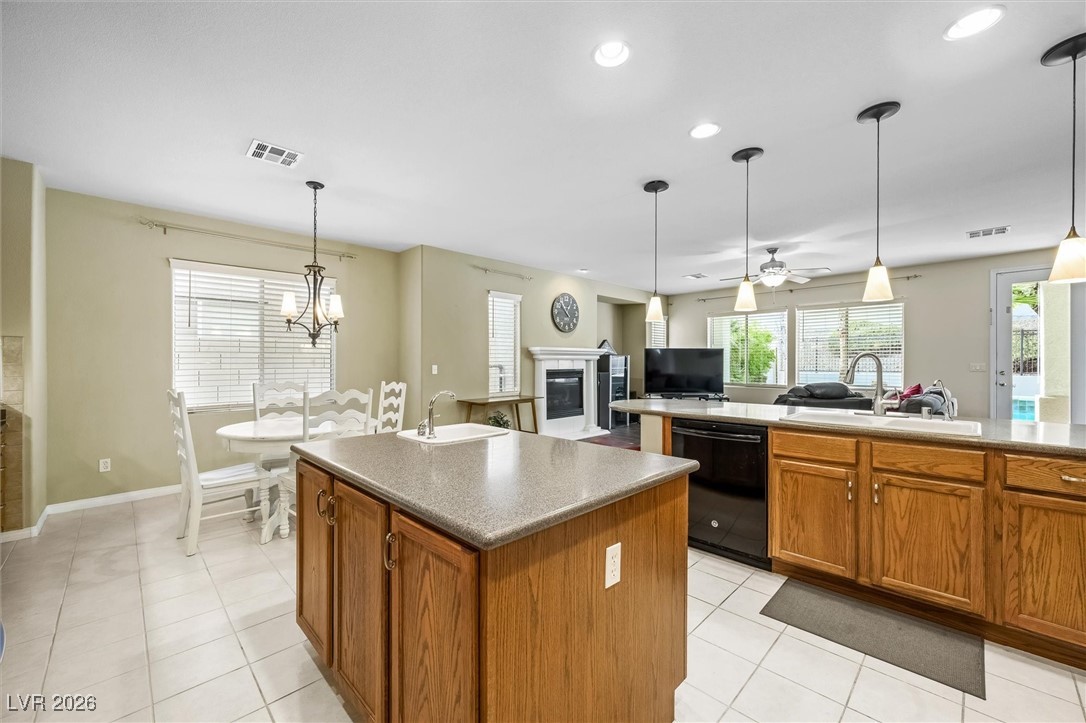 7517 Midnight Rambler Street Las Vegas, NV 89149 - Photo 26 of 68 View from standing at the stove into the eat in kitchen and family room.