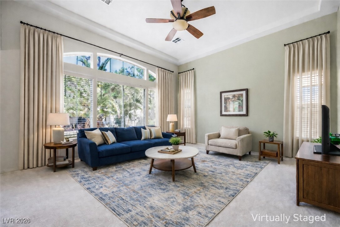 7517 Midnight Rambler Street Las Vegas, NV 89149 - Photo 9 of 68 Large living room with 17ft ceilings - virtually staged
