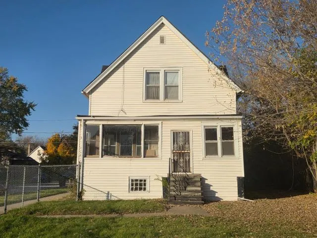 a view of house with backyard
