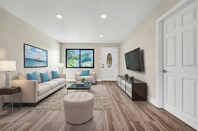 a living room with furniture and a flat screen tv