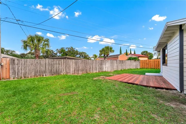 a view of yard with patio