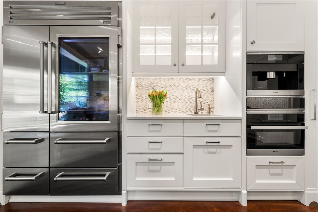 53 Crowninshield Road Brookline, MA 02446 - Photo 11 of 42 a kitchen with a stove and a microwave