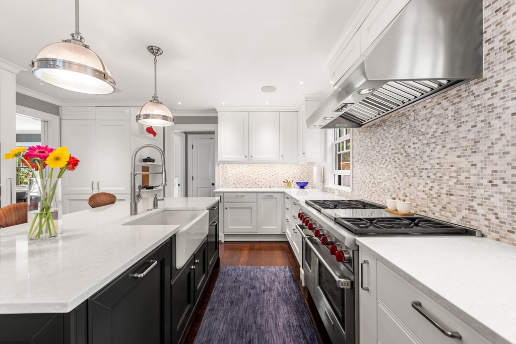 53 Crowninshield Road Brookline, MA 02446 - Photo 12 of 42 a kitchen that has a lot of cabinets