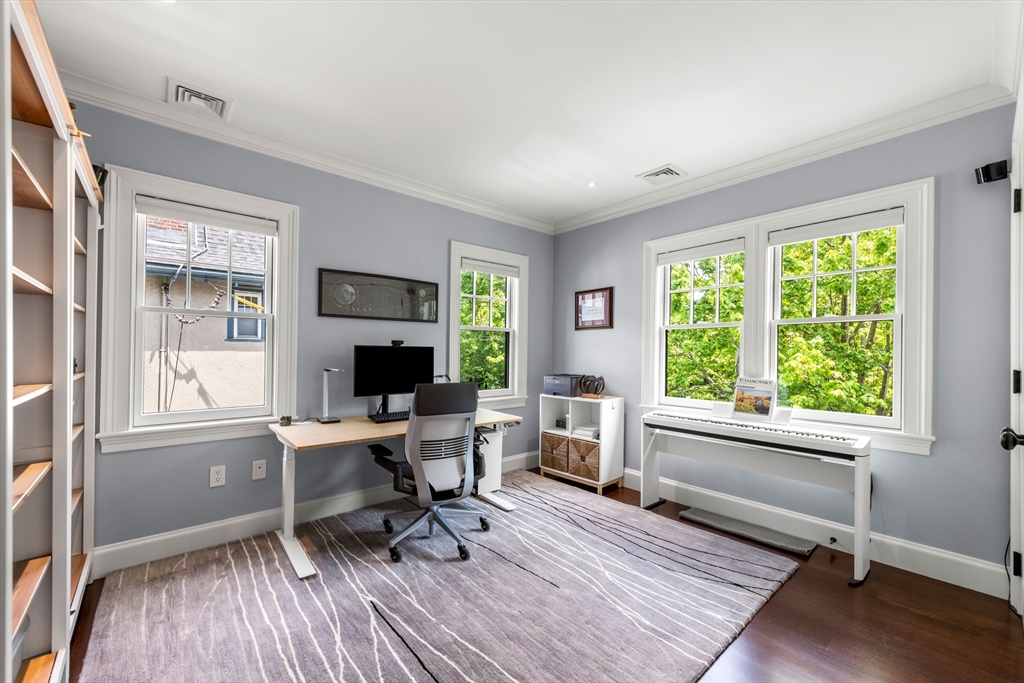 53 Crowninshield Road Brookline, MA 02446 - Photo 23 of 42 a workspace with wooden floor and a window