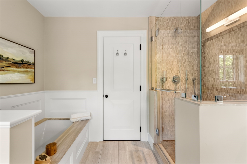 53 Crowninshield Road Brookline, MA 02446 - Photo 25 of 42 a bathroom with a tub and shower