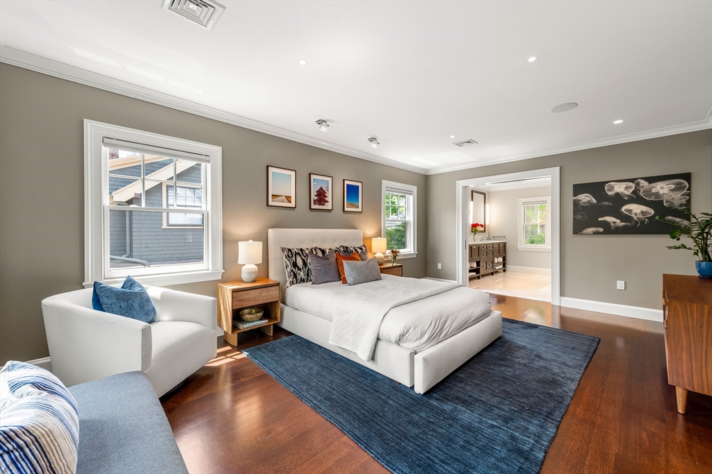 53 Crowninshield Road Brookline, MA 02446 - Photo 28 of 42 a bedroom with a large bed couch and a window