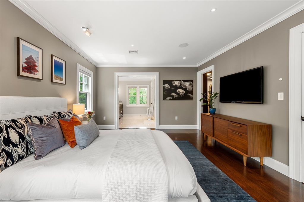 53 Crowninshield Road Brookline, MA 02446 - Photo 29 of 42 a bedroom with a bed and a flat screen television