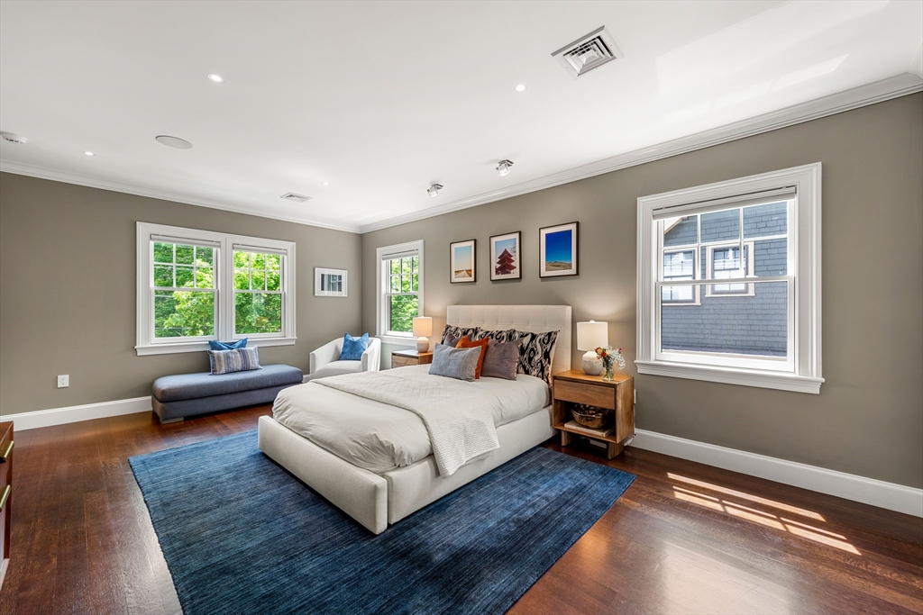 53 Crowninshield Road Brookline, MA 02446 - Photo 30 of 42 a bedroom with a bed wooden floor and window