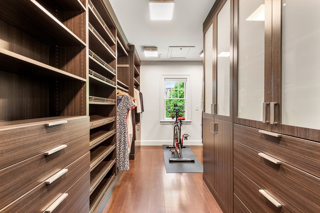 53 Crowninshield Road Brookline, MA 02446 - Photo 31 of 42 a view of walk in closet with clothes and shoes