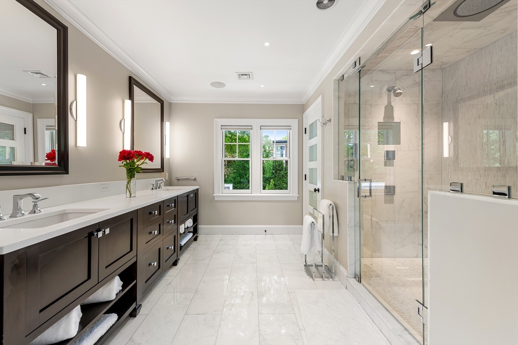 53 Crowninshield Road Brookline, MA 02446 - Photo 32 of 42 a bathroom with a double vanity sink mirror double vanity and shower