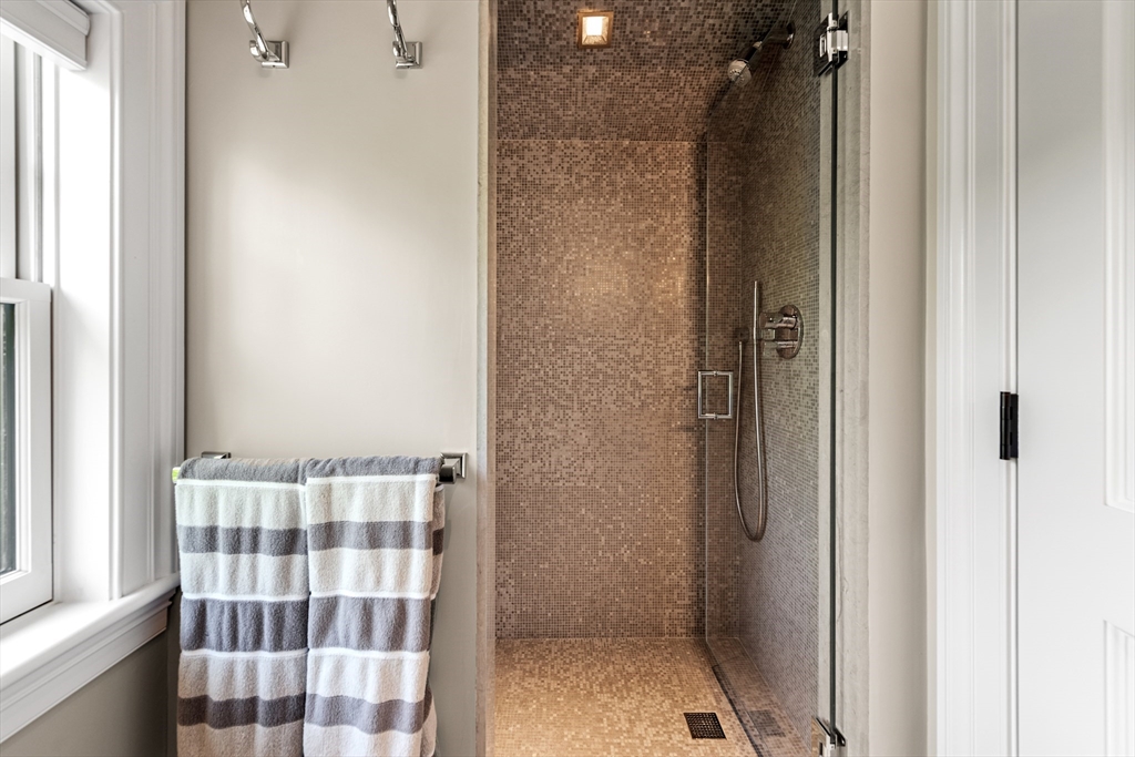 53 Crowninshield Road Brookline, MA 02446 - Photo 37 of 42 a bathroom with a sink and a shower