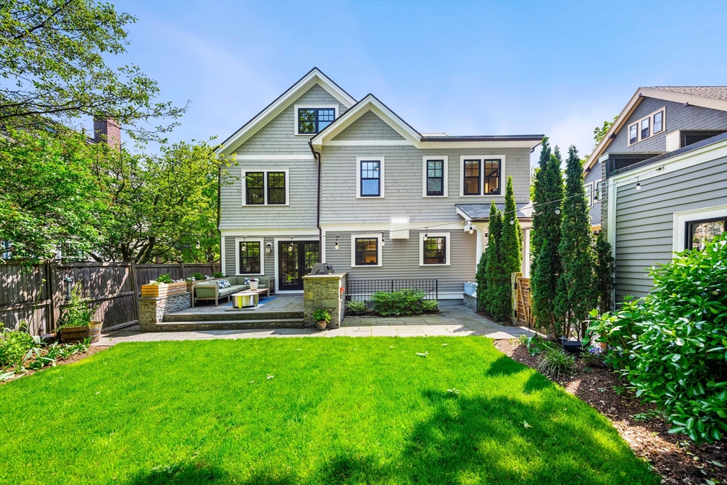 53 Crowninshield Road Brookline, MA 02446 - Photo 5 of 42 a view of a house with a yard and sitting area