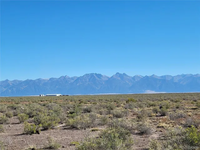 a view of mountain and a field