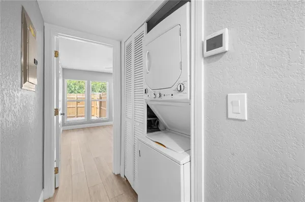 a room that has a window and a wooden floor