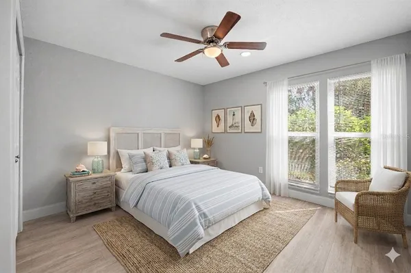 a bedroom with a large bed and a large window