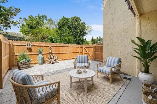 a view of a chair and table in the patio