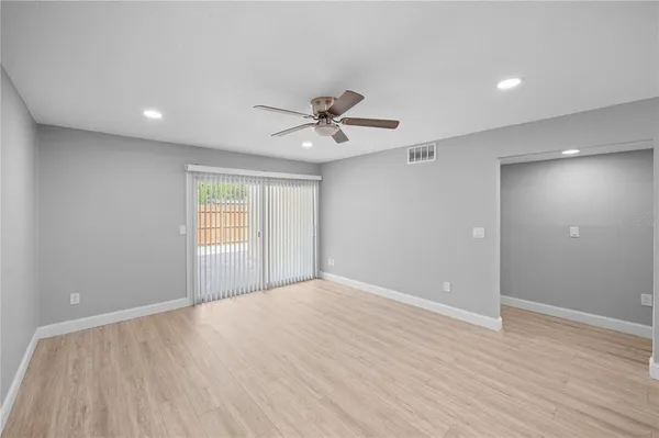 a view of an empty room with a window