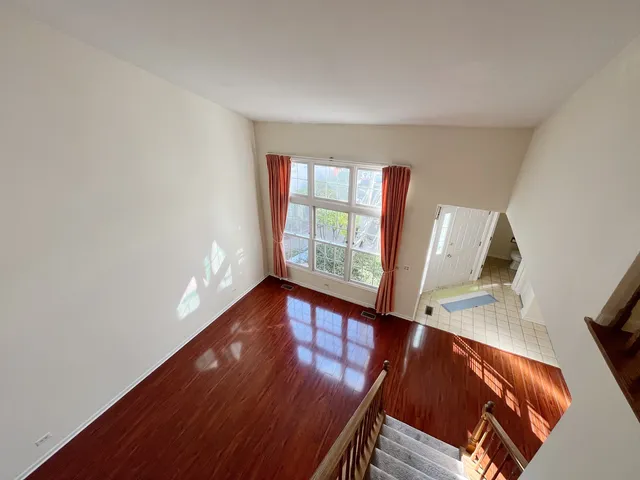 a view of an entryway with wooden floor