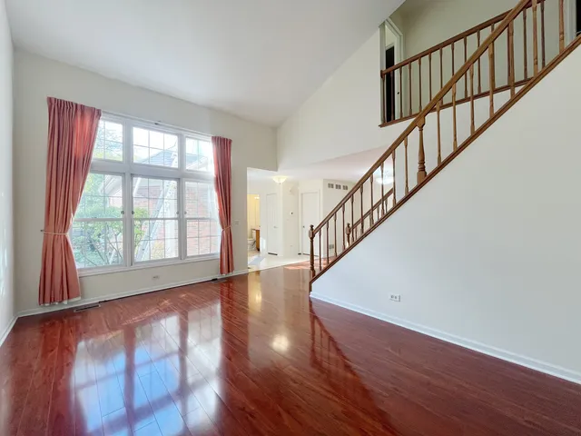 a view of an entryway with wooden floor