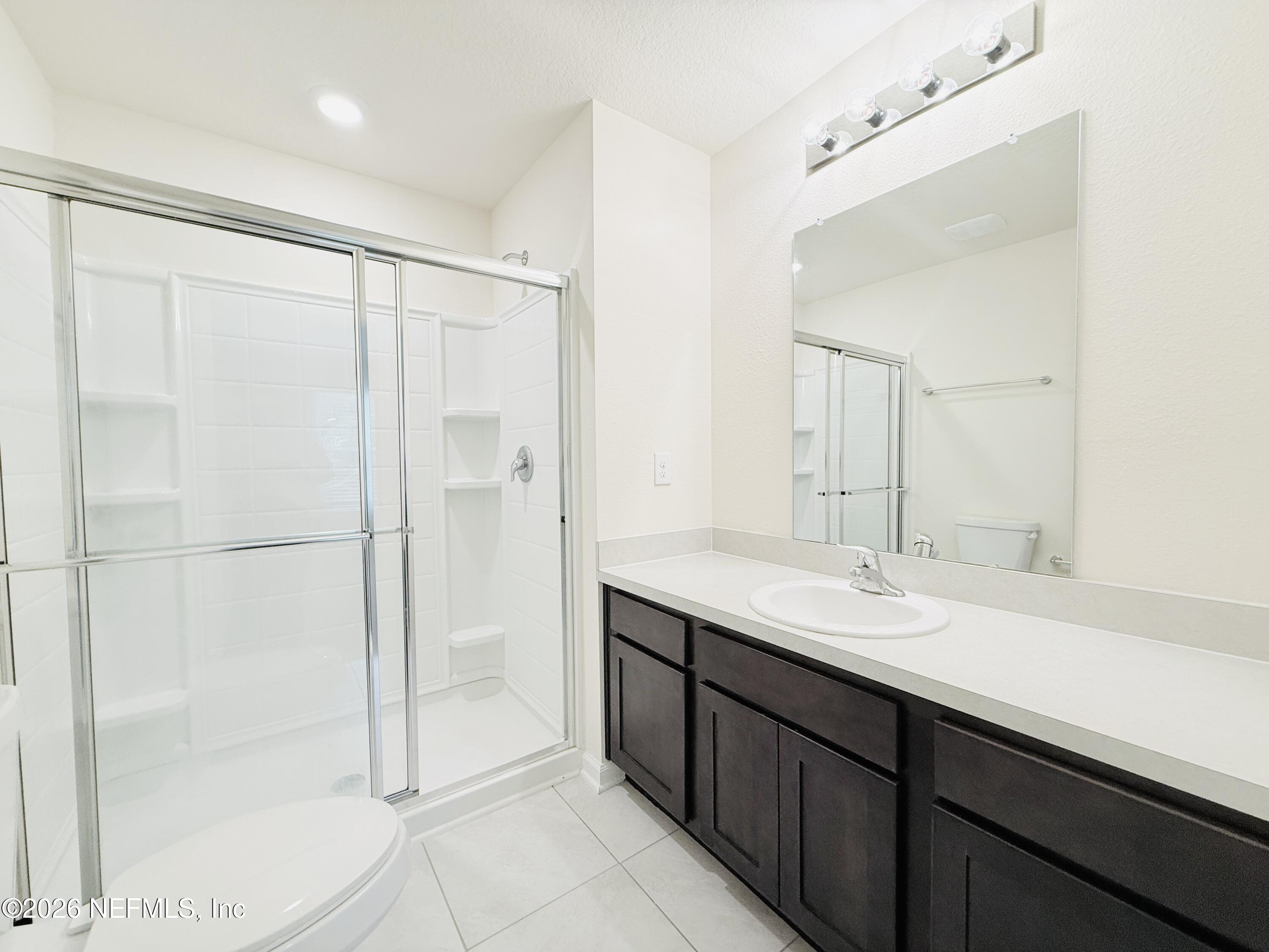 847 Gate Run Road Jacksonville, FL 32211 - Photo 12 of 19 a bathroom with a double vanity sink mirror and shower
