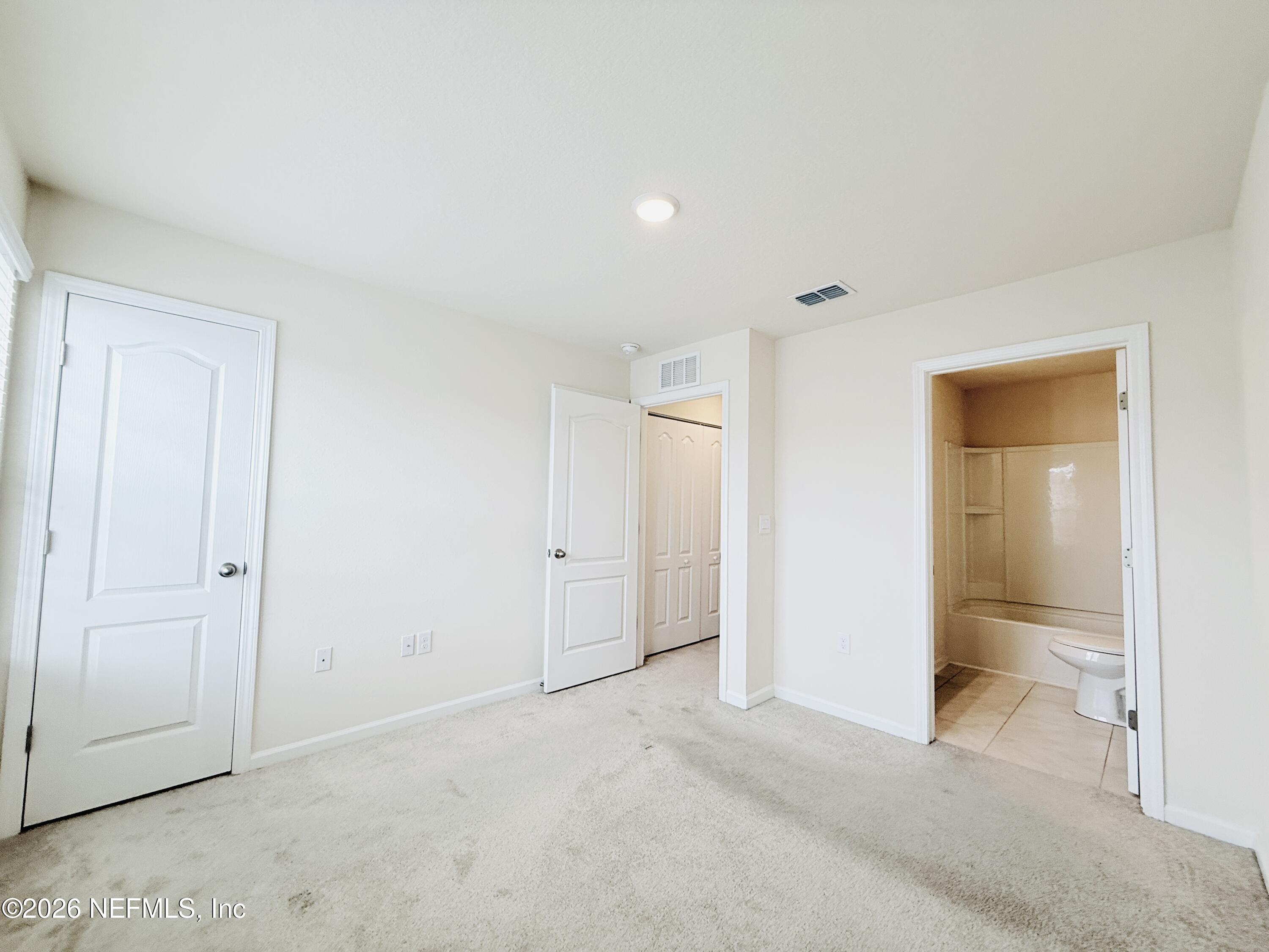 847 Gate Run Road Jacksonville, FL 32211 - Photo 14 of 19 a view of an empty room and closet area