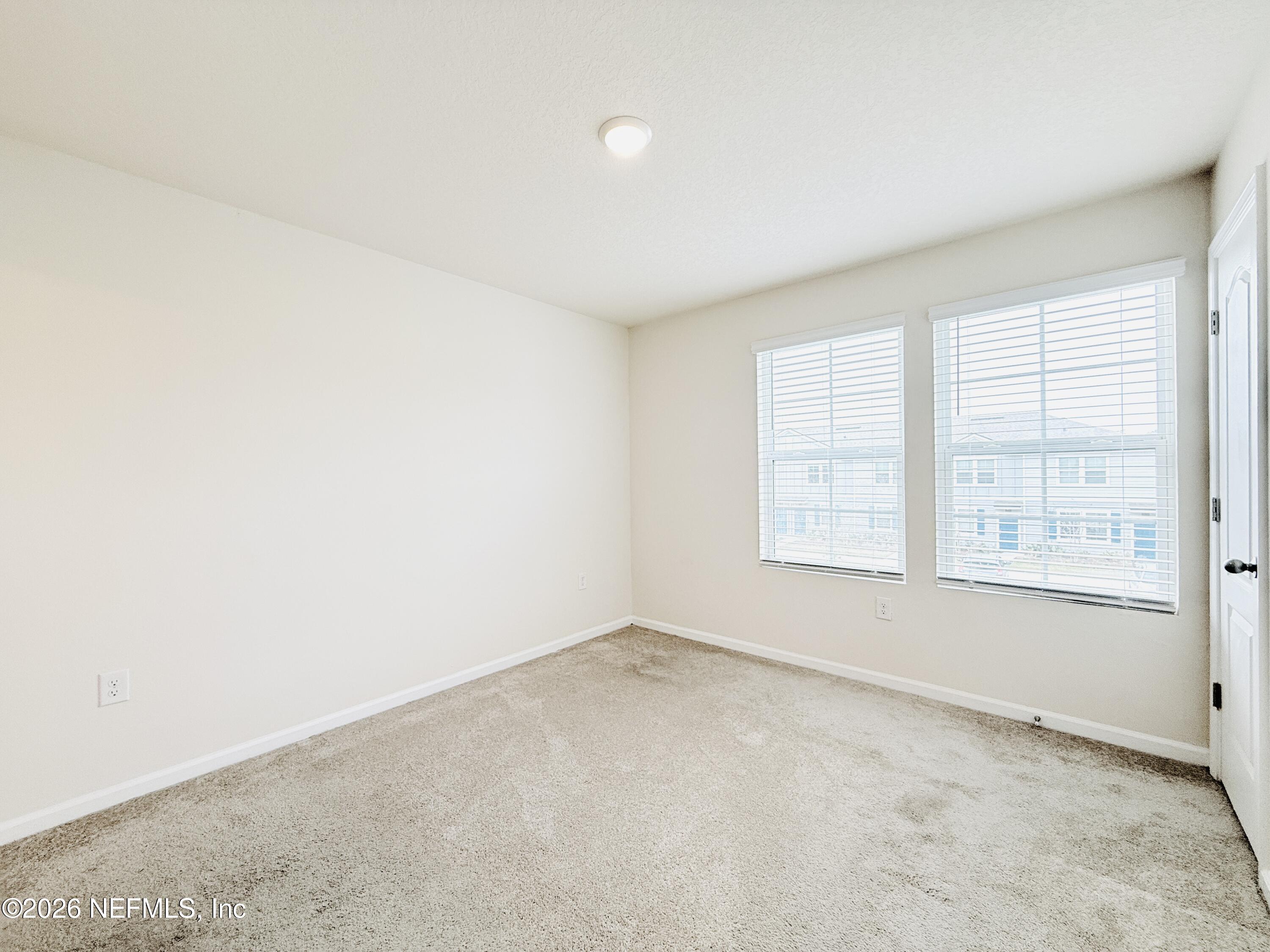 847 Gate Run Road Jacksonville, FL 32211 - Photo 15 of 19 an empty room with windows