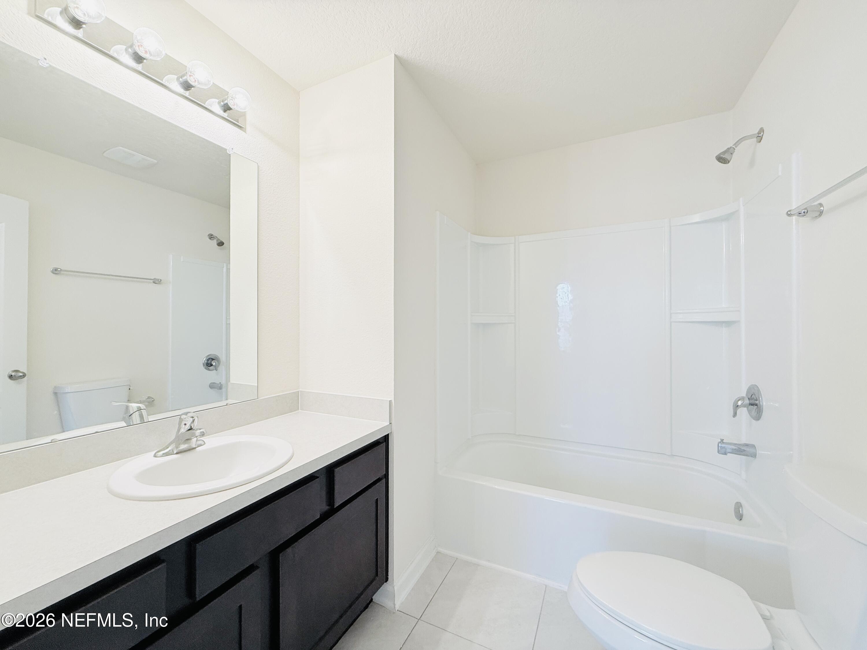 847 Gate Run Road Jacksonville, FL 32211 - Photo 17 of 19 a bathroom with a sink a toilet and bathtub