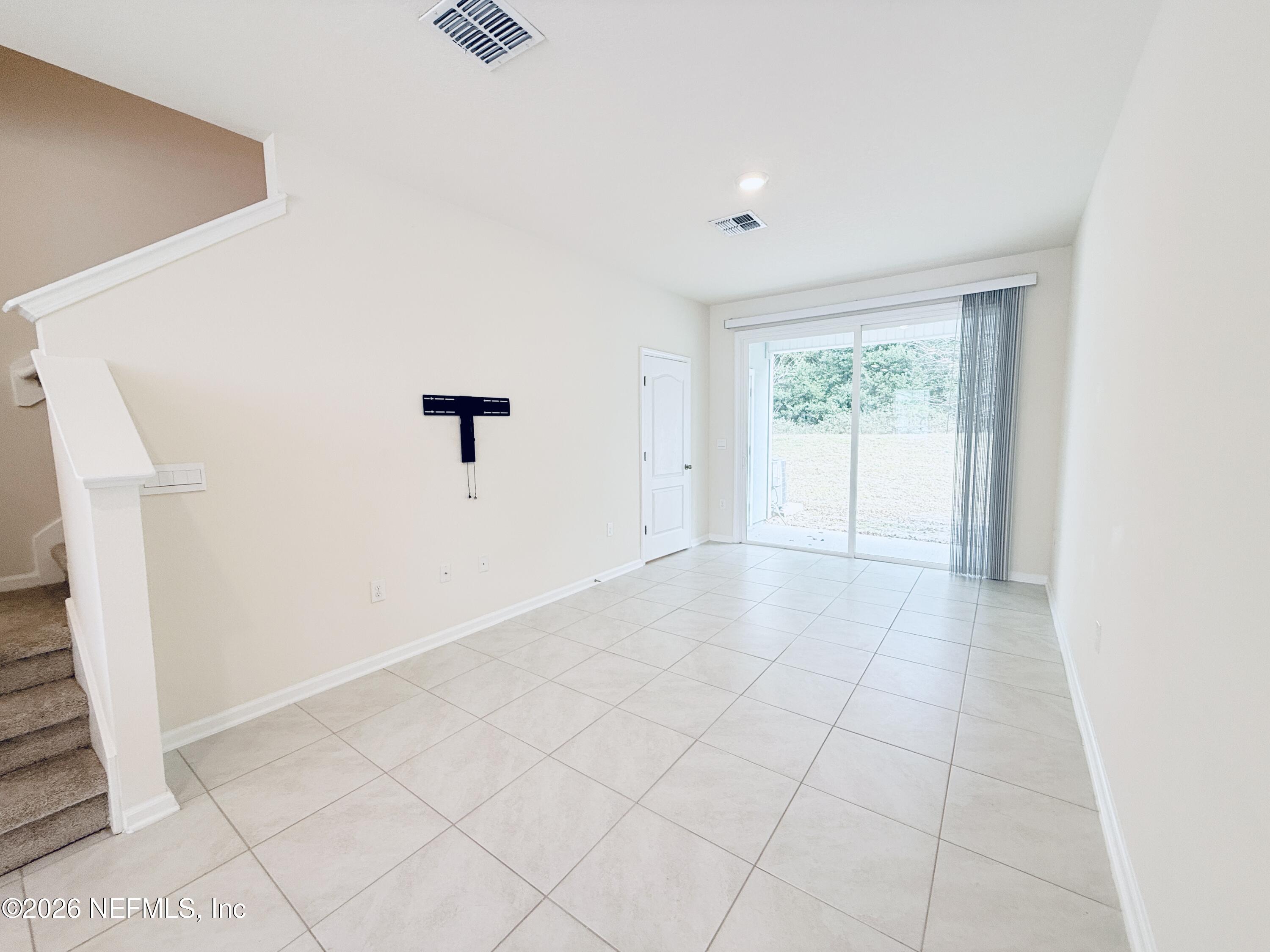 847 Gate Run Road Jacksonville, FL 32211 - Photo 5 of 19 an empty room with windows