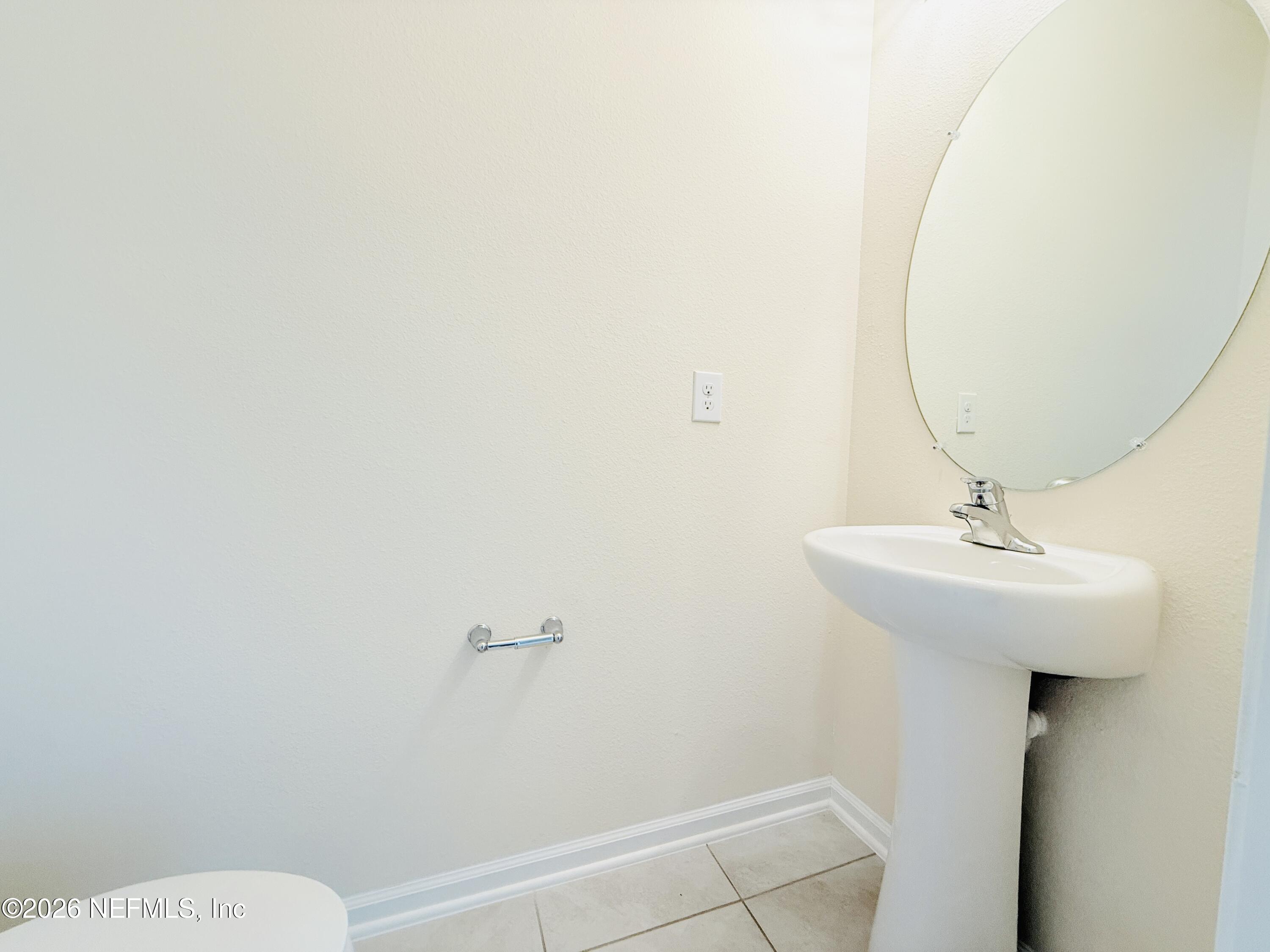 847 Gate Run Road Jacksonville, FL 32211 - Photo 8 of 19 a bathroom with a sink a toilet and a mirror