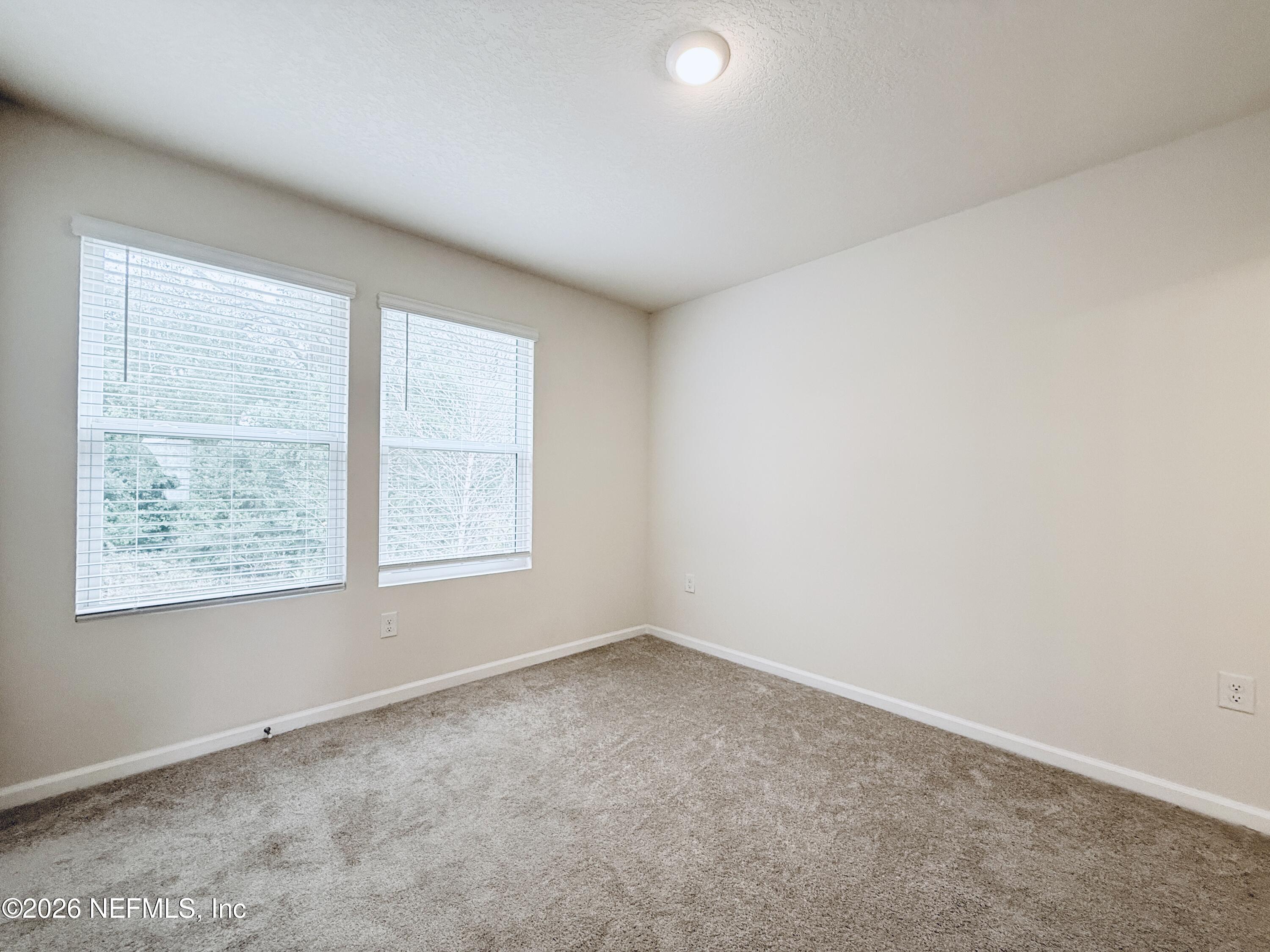 847 Gate Run Road Jacksonville, FL 32211 - Photo 9 of 19 an empty room with a window