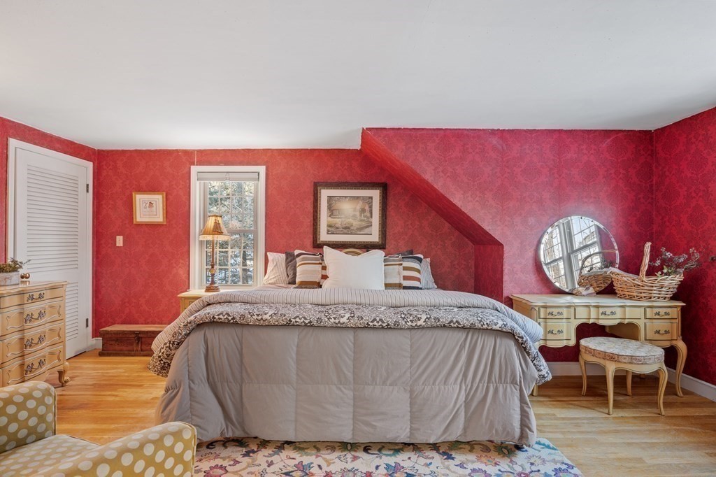 6 Oxford Road Hampstead, NH 03841 - Photo 16 of 32 a bedroom with a bed and wooden floor