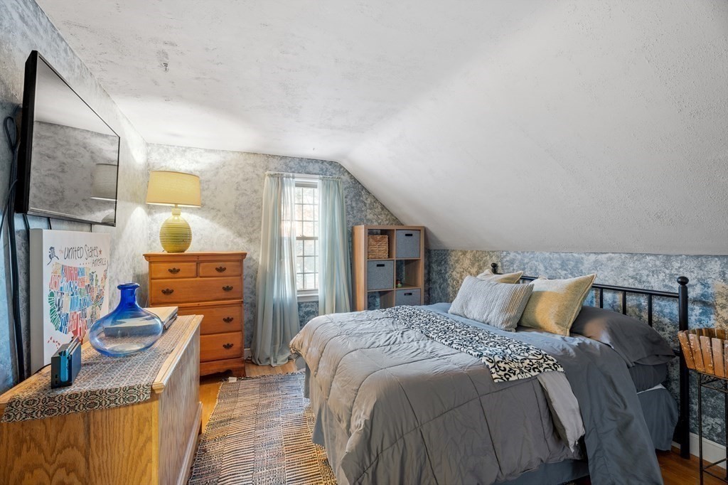 6 Oxford Road Hampstead, NH 03841 - Photo 21 of 32 a bedroom with a bed dresser and mirror